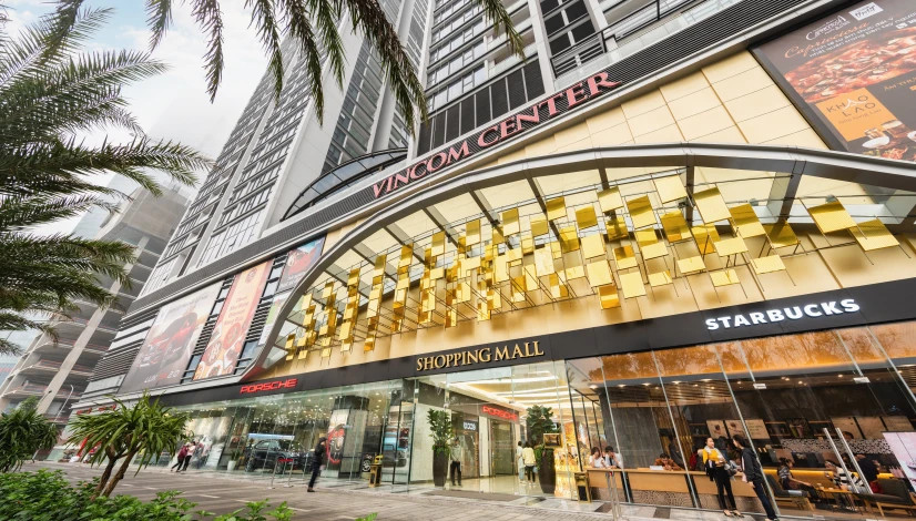 Biểu tượng nhận diện của Vincom Center, kèm cảnh báo về các chiêu trò lừa đảo trực tuyến