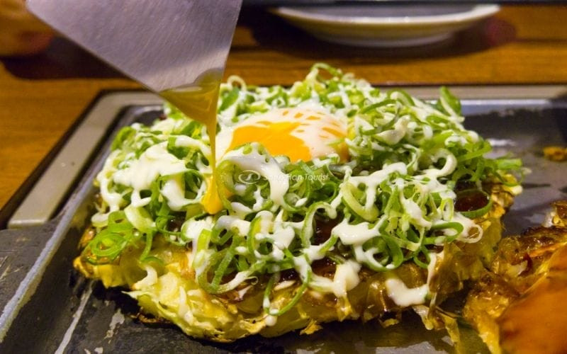 Hiroshima: Unique layered pancake, with noodles and fried eggs