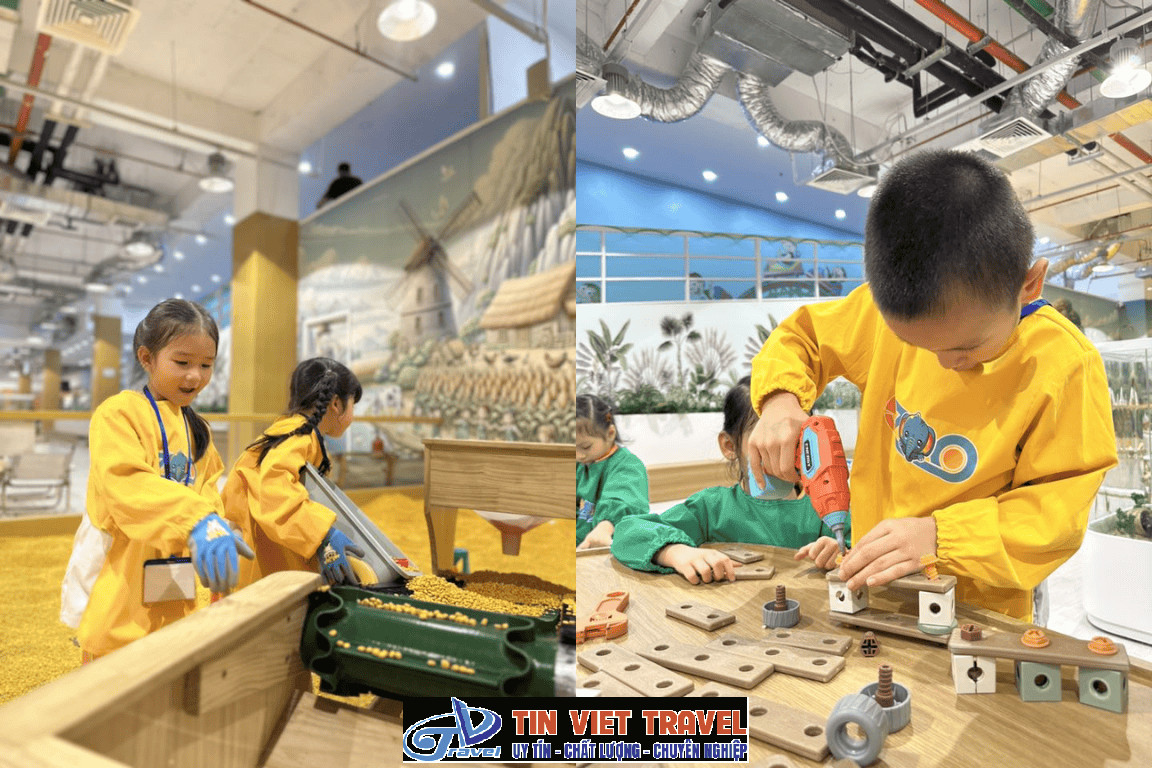 Trẻ em vui vẻ cho cừu ăn tại sở thú trong nhà EZOO Vincom Thảo Điền